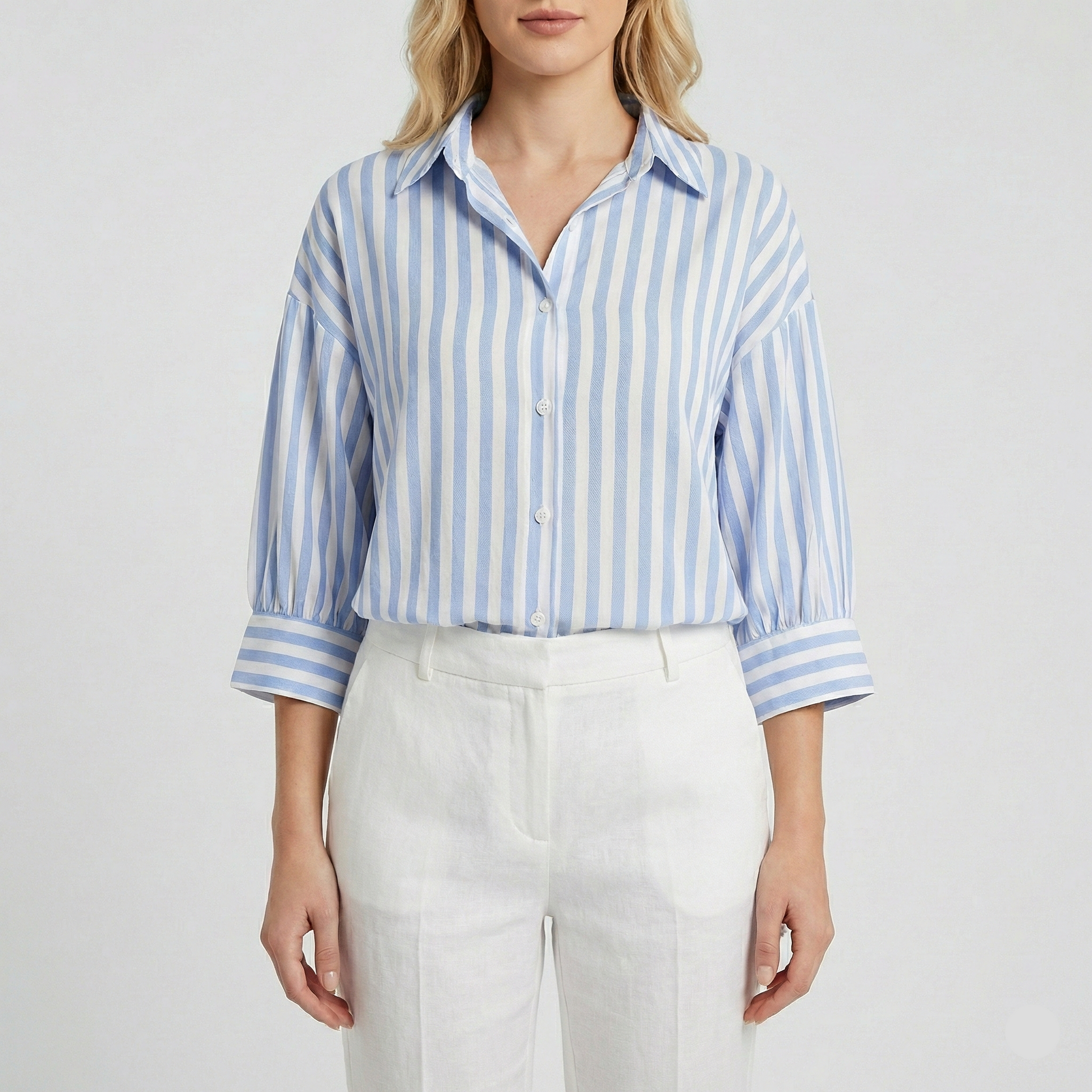Vertical striped button-down shirt with a spread collar and three-quarter sleeves.