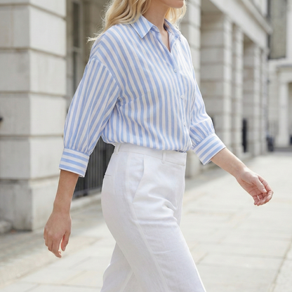 Vertical striped button-down shirt with a spread collar and three-quarter sleeves.