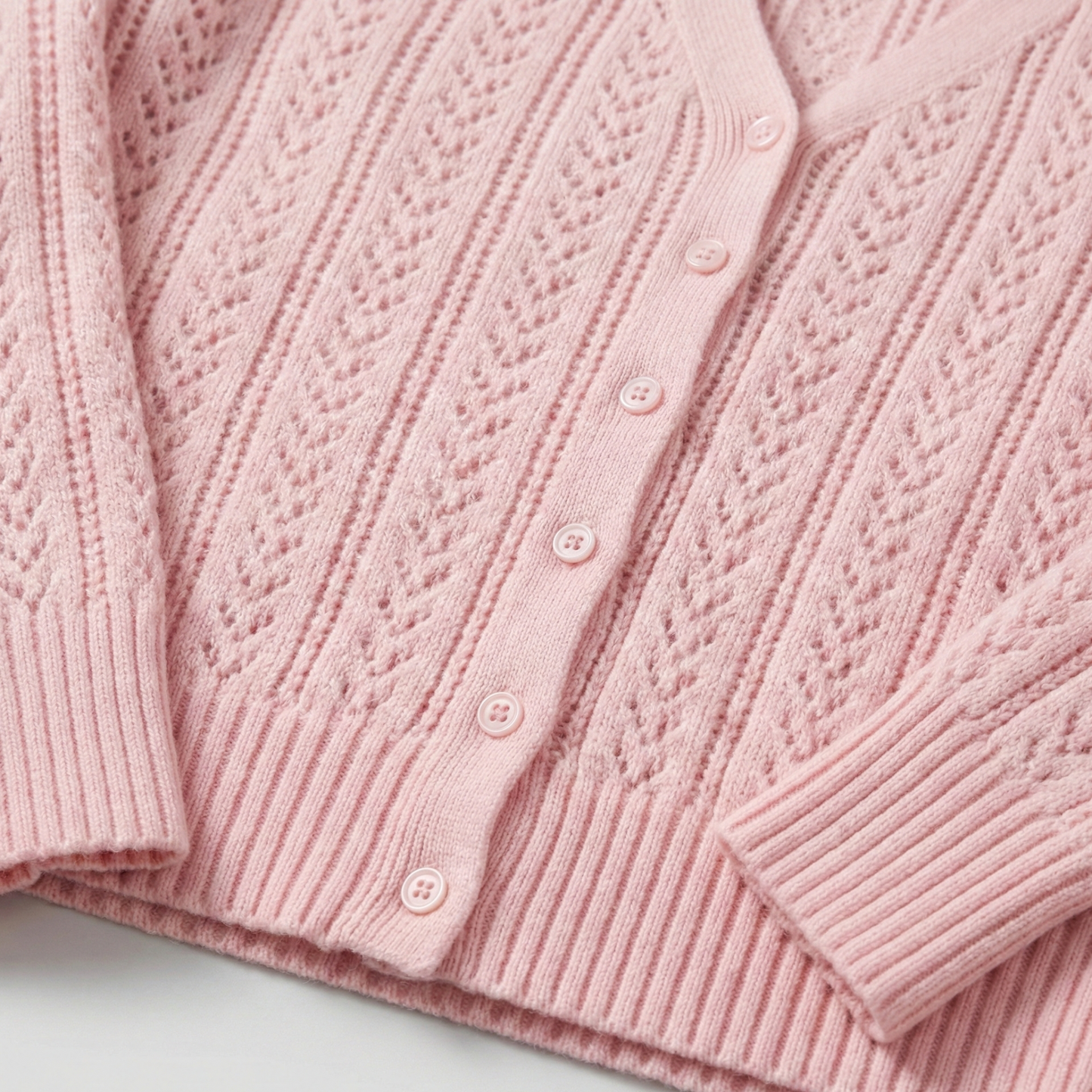 Pointelle knit cardigan with V-neck and button-down front