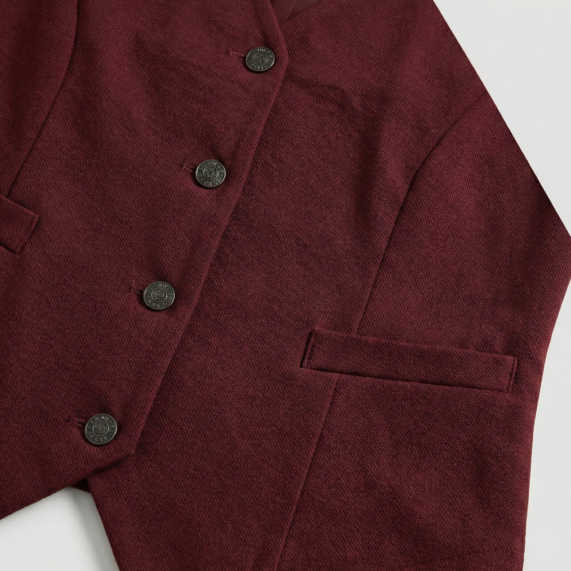 Tailored waistcoat vest with button-down front and welt pocket details