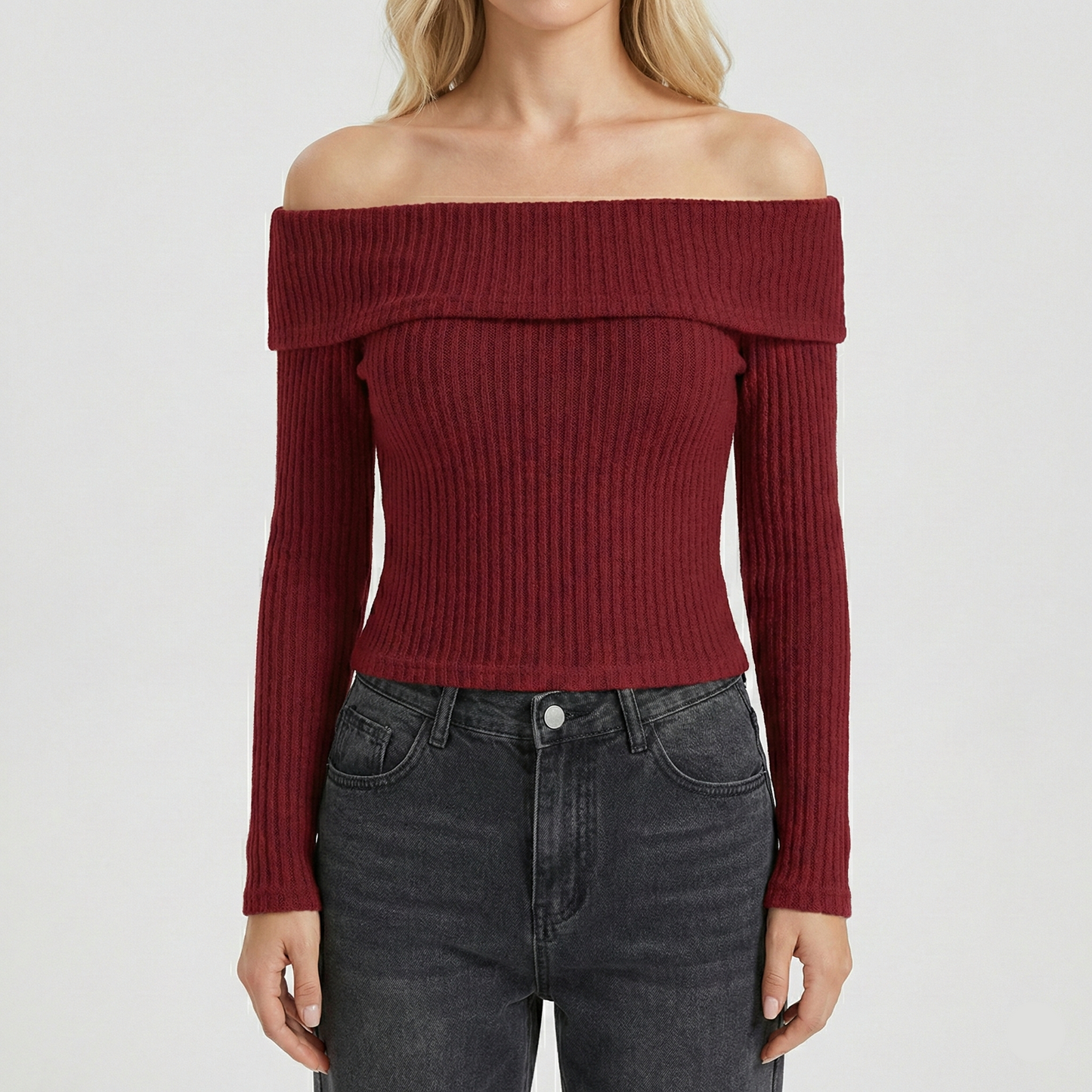 Ribbed knit long-sleeved top featuring an off-the-shoulder fold-over neckline and a cropped fit.