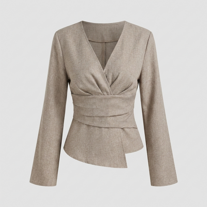 Tailored wrap-style blouse with a V-neckline and long bell sleeves, featuring a pleated waist detail and asymmetrical hem.