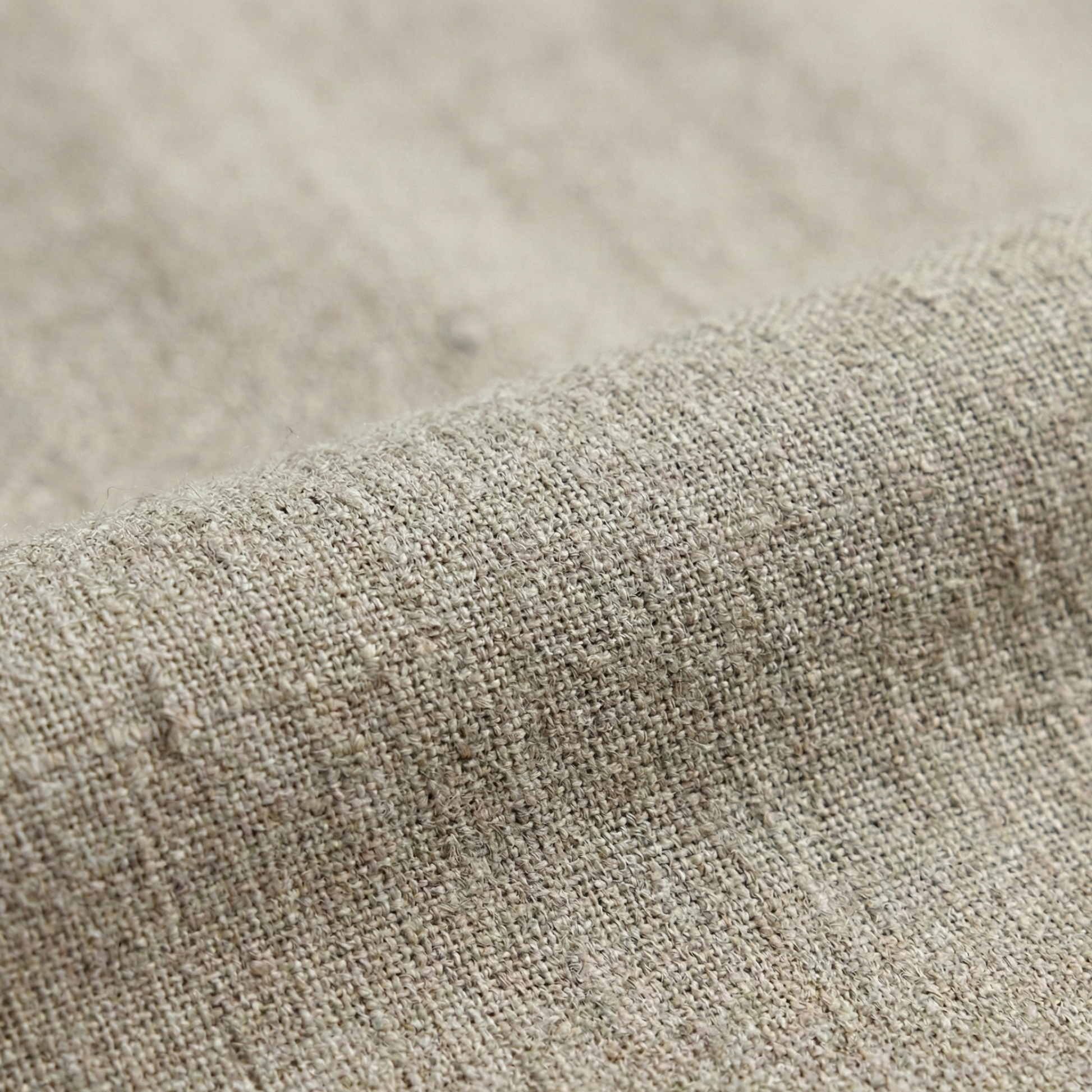 Tailored wrap-style blouse with a V-neckline and long bell sleeves, featuring a pleated waist detail and asymmetrical hem.