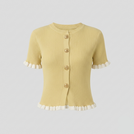 Ribbed knit short-sleeve cardigan featuring decorative gold buttons and white ruffled trim along the cuffs and hem.