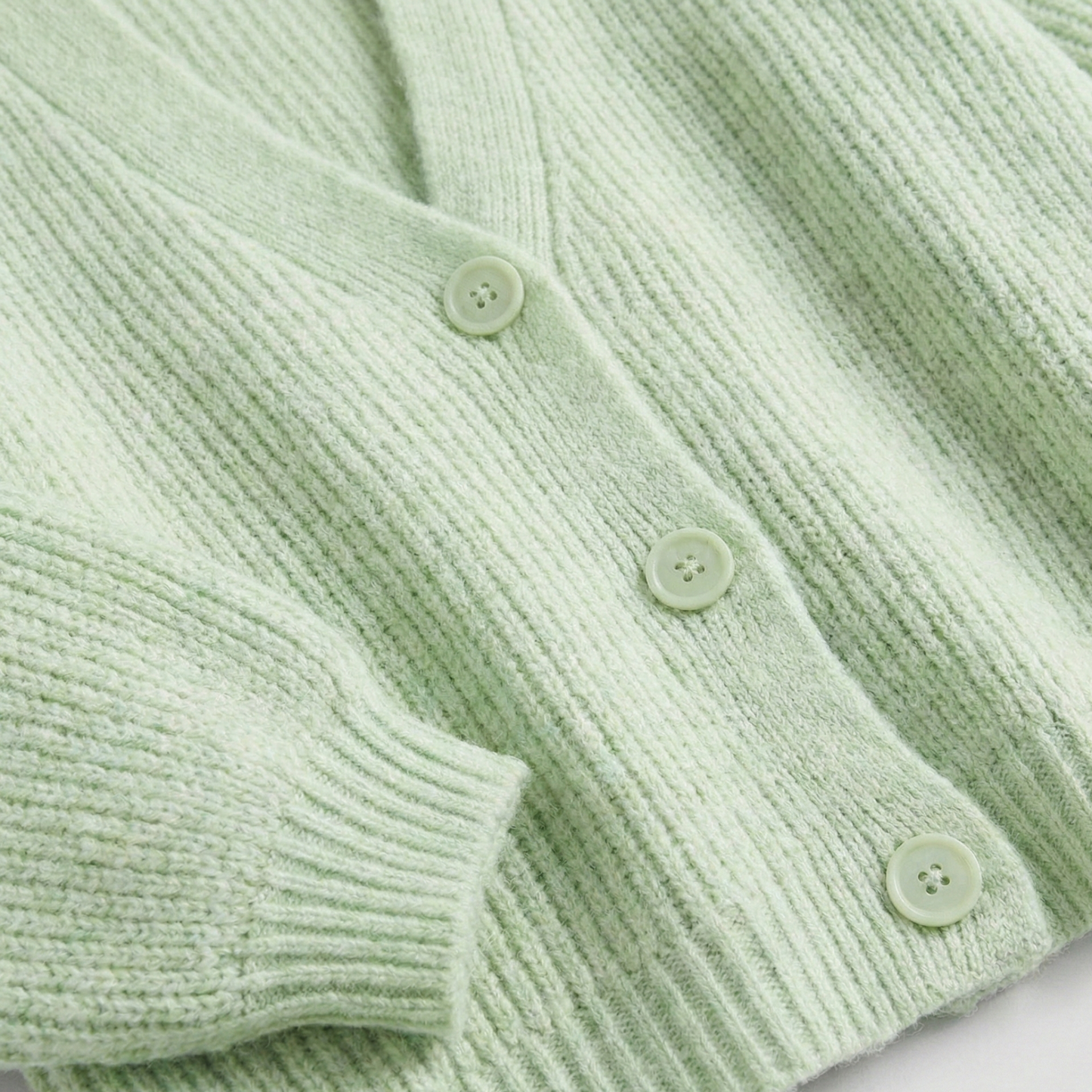 Chunky knit cardigan with oversized lantern sleeves and button-down front